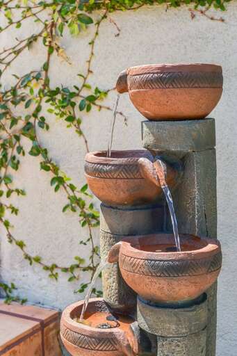 Enjoy the soothing sounds of our outdoor fountain, a perfect spot to relax and unwind in a peaceful setting. Enjoy the soothing sounds of our outdoor fountain, a perfect spot to relax and unwind in a peaceful setting.
